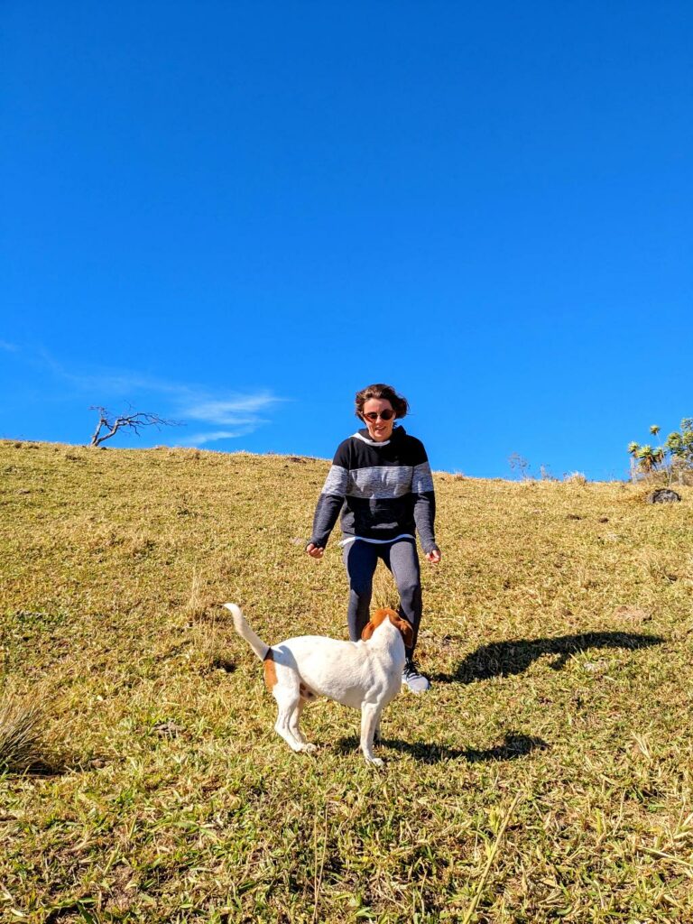 A joyful interaction with Yupi the dog, playing enthusiastically in an outdoor setting