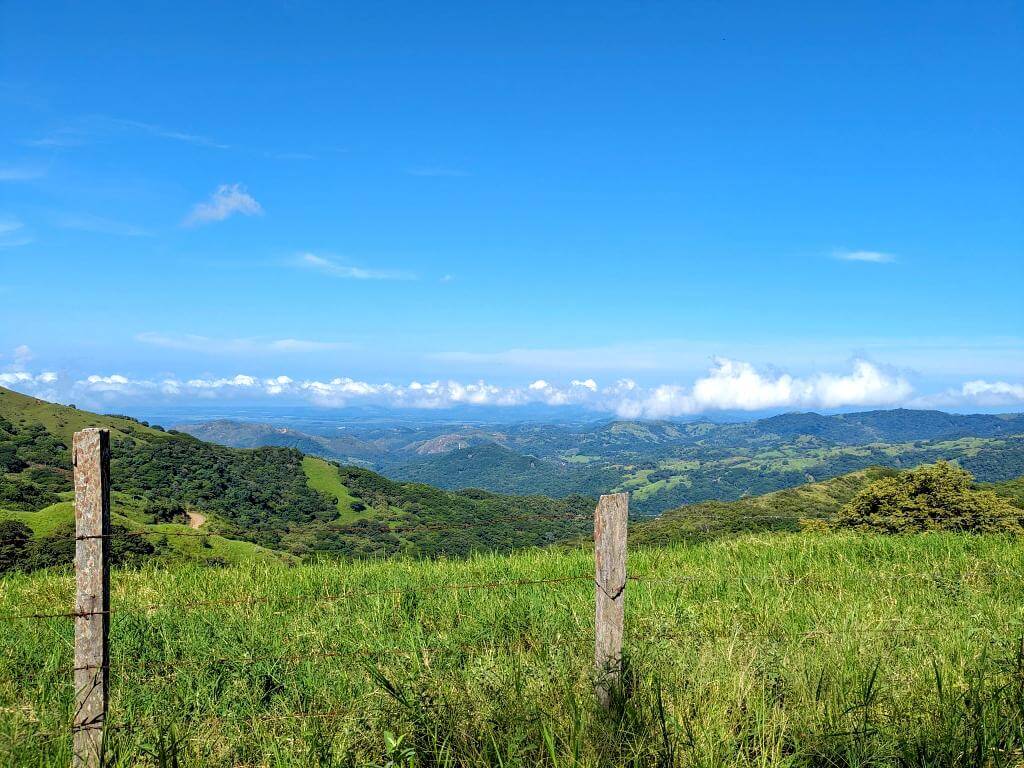 Scenic vista from the trailhead, showcasing the Nicoya Gulf and surrounding hills.