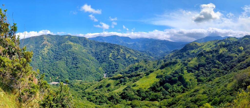 Panoramic view from El Encanto Trail highlighting the lush landscapes during the rainy season.