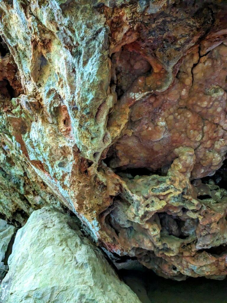 Close-up of radiant Citrine Quartz Crystal formations embedded in rock layers at Boquerones Hike in Bajo Caliente, Puntarenas.