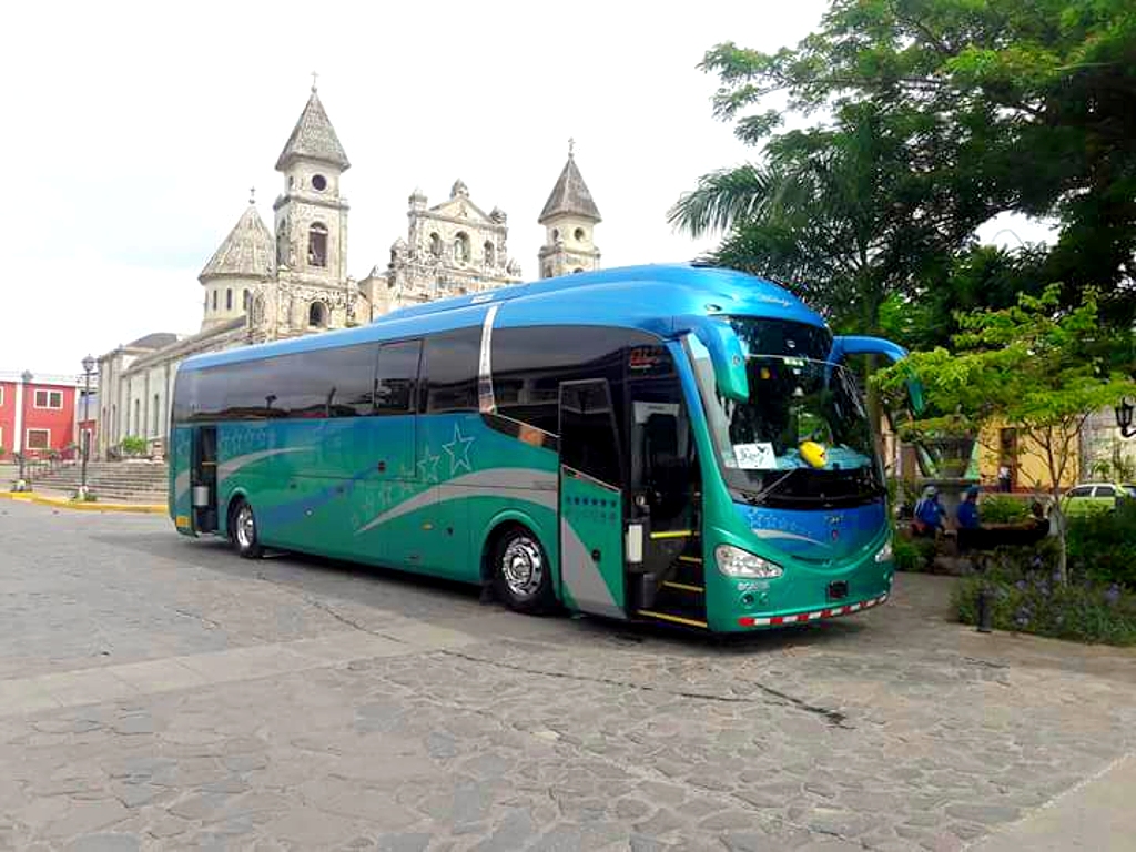 Large bus designed for 50 passengers, boasting spacious luggage areas, A/C, reclining seats, and all mandatory insurances.