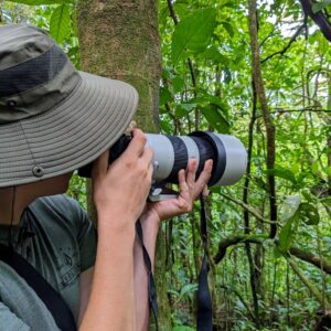 Wilson Salas Jiménez, an experienced Costa Rican naturalist and avid birdwatcher, founder of AmazonaBirdLife, capturing a picture during a birdwatching tour.