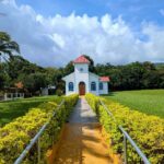Small Catholic church with white walls and red roof in Cuipilapa, at the foothills of Miravalles Volcano.