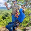 Professional staff giving safety instructions before the canopy tour, with clients equipped and ready to go.
