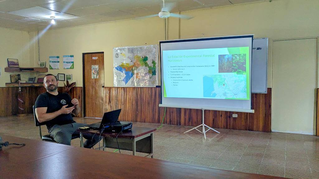 A biologist gives a presentation about the dry forest and a wildlife monitoring project in Costa Rica.